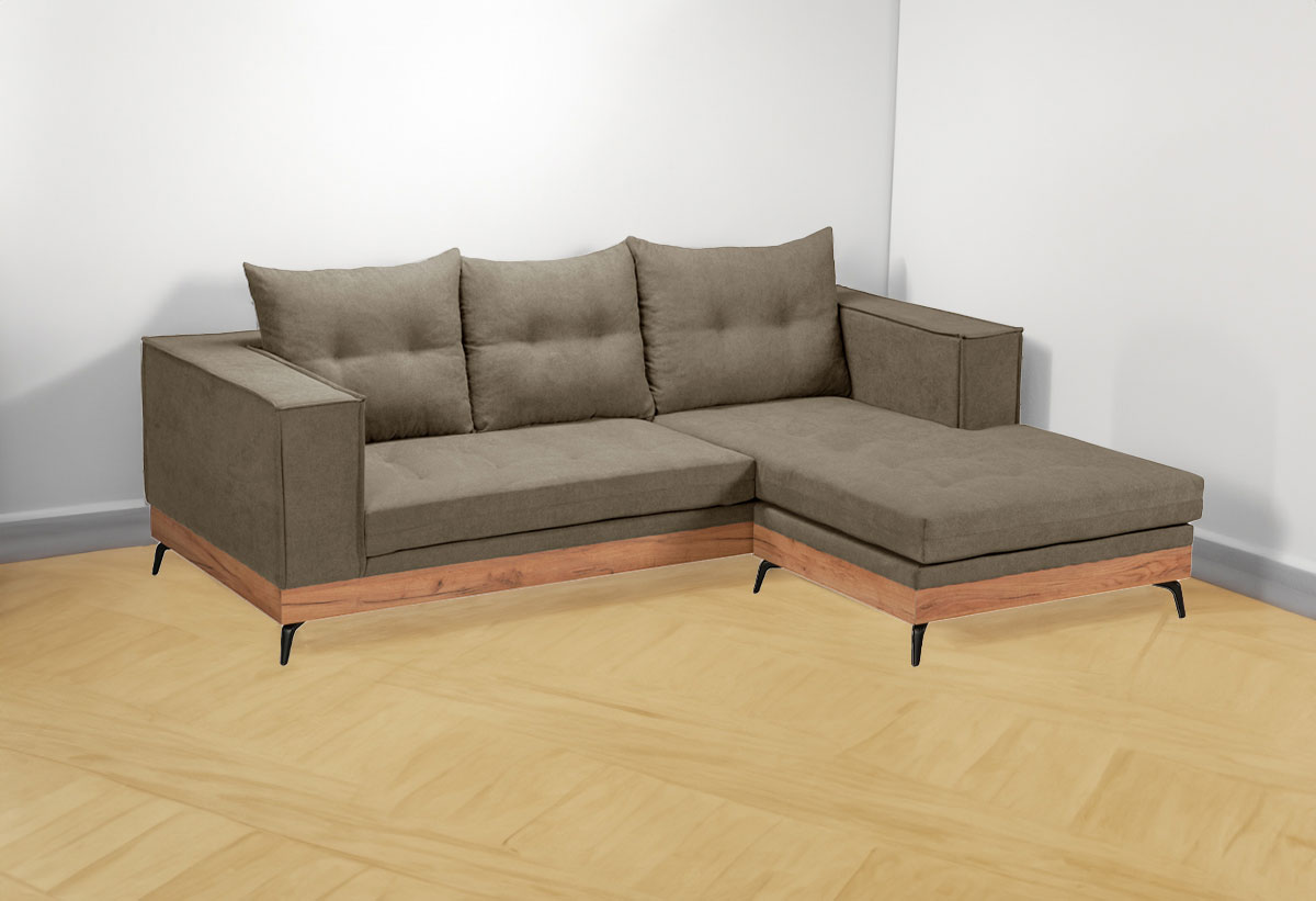 Απεικονίζεται ο καναπές σε εναν χώρο.